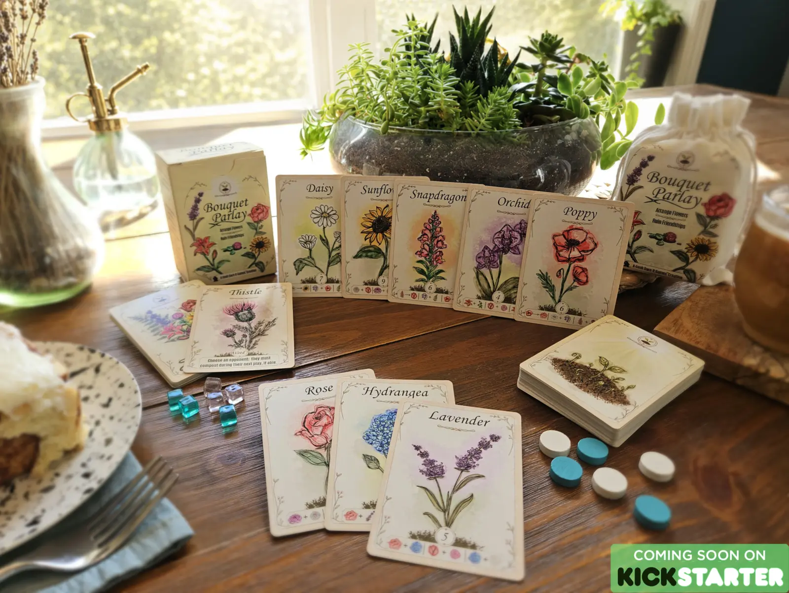 Bouquet Parlay box, cards, pouch, and flower-filled tabletop display